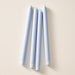 Four mint colored taper candles standing upright in a vertical row on a warm beige background.