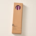 A tall, narrow cardboard box with a circular window display cutout at the top showing two blackberry candles inside, photographed on a clean off-white background. The box has printed text near the bottom including the brand name 'Ten Thousand Villages'.